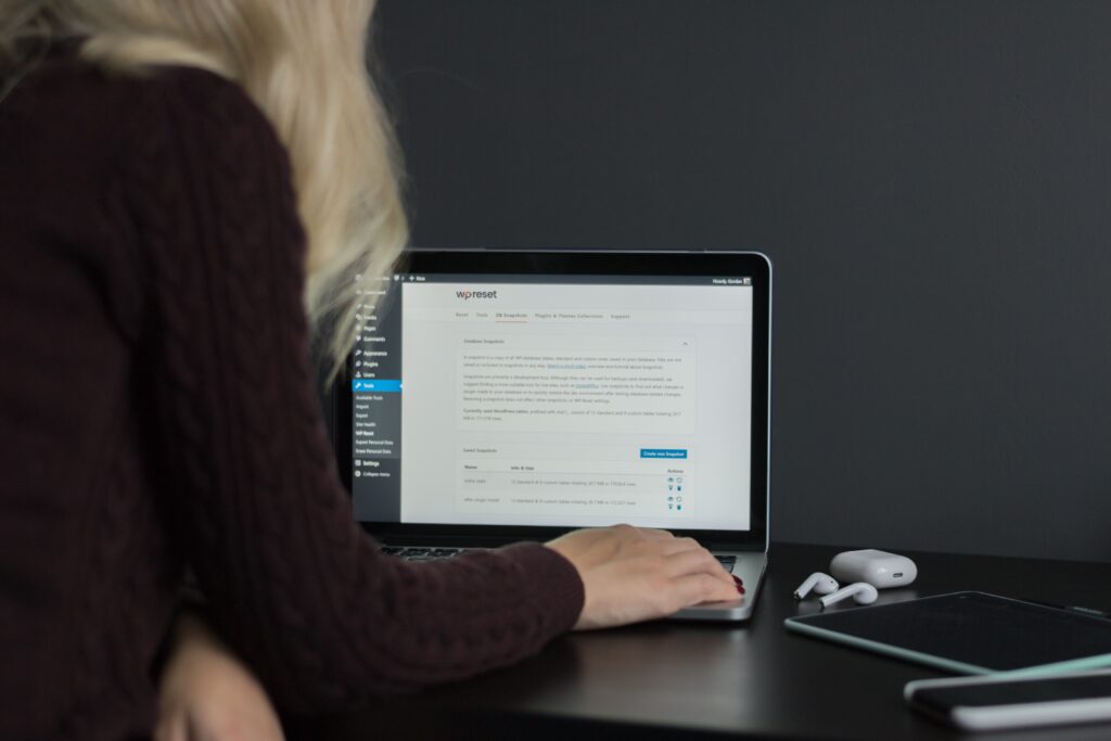 woman on laptop working in wordpress screen