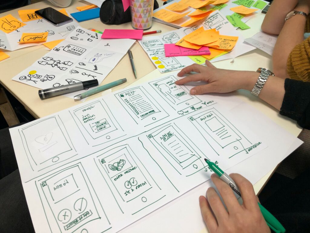 a website design plan being written out on paper