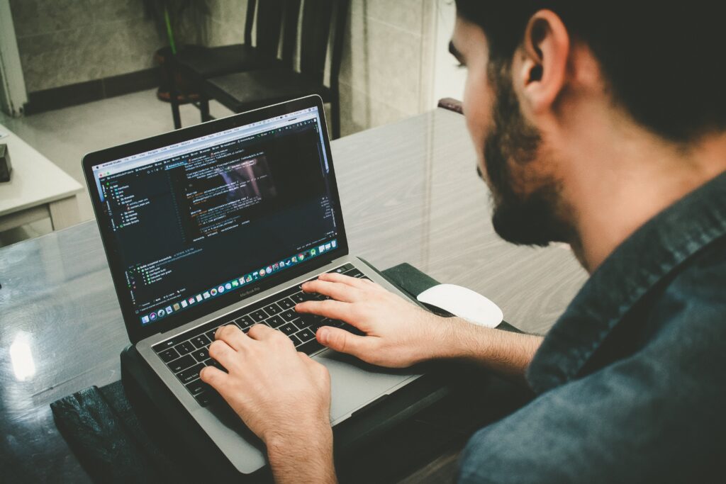 man on a laptop optimizing his website code