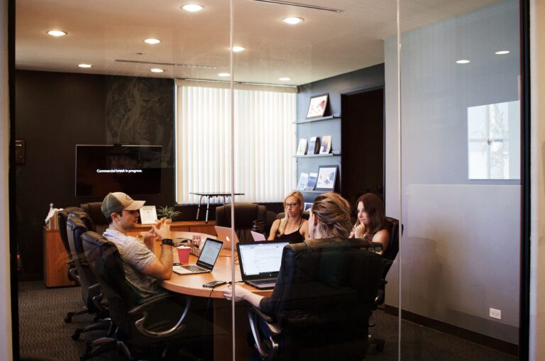 marketing team in a meeting doing elevator pitches