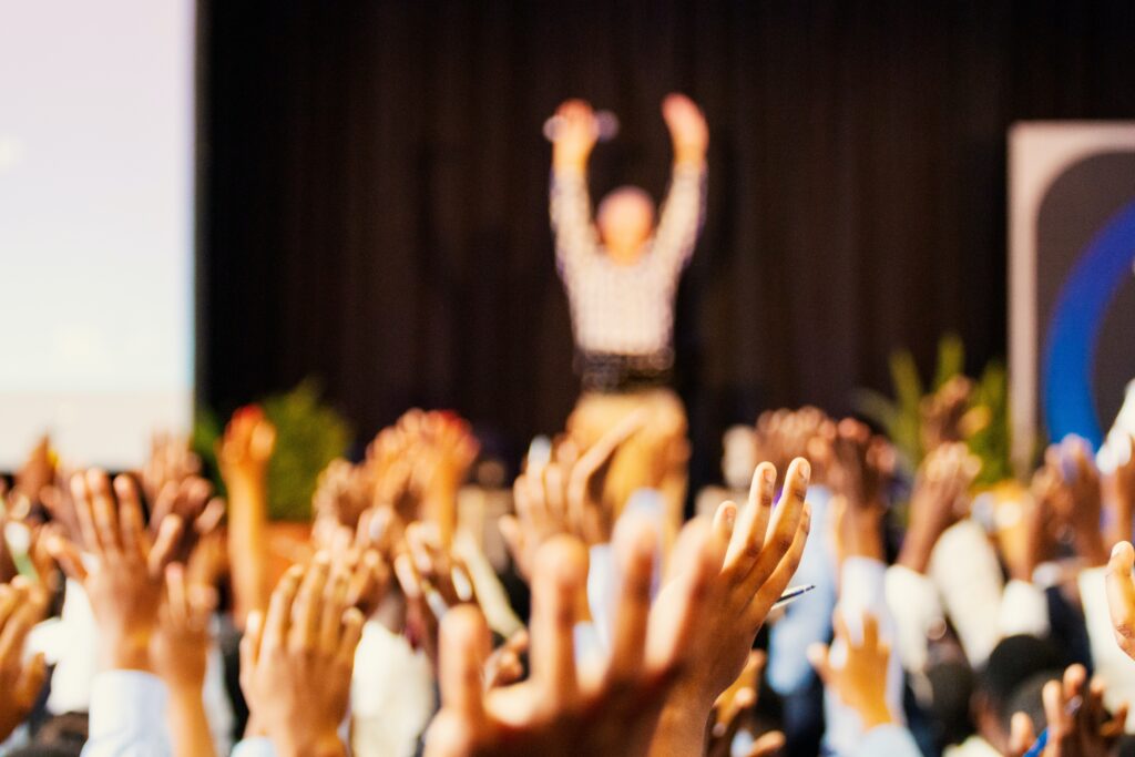 person asking for crowd participation during a conference